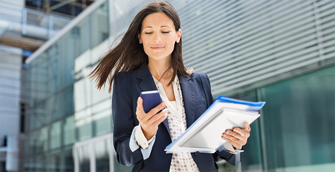 Woman confidently managing mid-market contingent staffing with the support of an MSP and a VMS solution